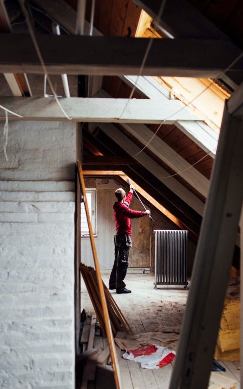 Person renovating an attic space